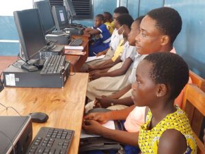 Students sitting behind computers