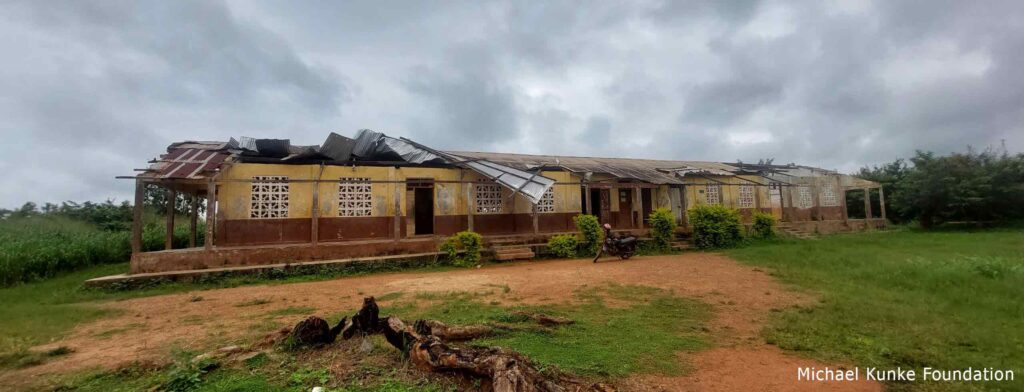 School building with roofing ripped off 